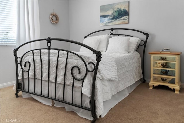 carpeted bedroom with baseboards