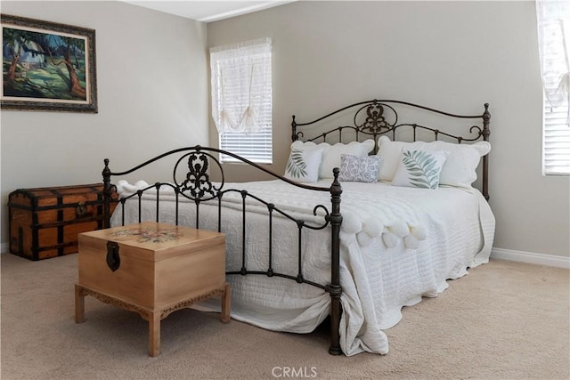 carpeted bedroom with baseboards