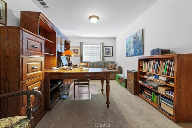 carpeted home office with visible vents