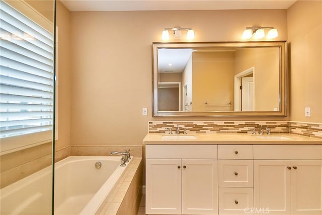 54 Trotter, Irvine, CA 92602 - full bathroom with double vanity, a bath, and backsplash