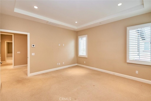 54 Trotter, Irvine, CA 92602 - empty room featuring a tray ceiling, light carpet, and recessed lighting