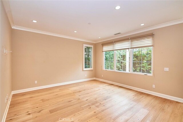 54 Trotter, Irvine, CA 92602 - empty room featuring ornamental molding, light wood-type flooring, and recessed lighting