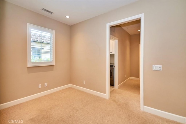54 Trotter, Irvine, CA 92602 - empty room featuring light carpet, recessed lighting, and washer / clothes dryer