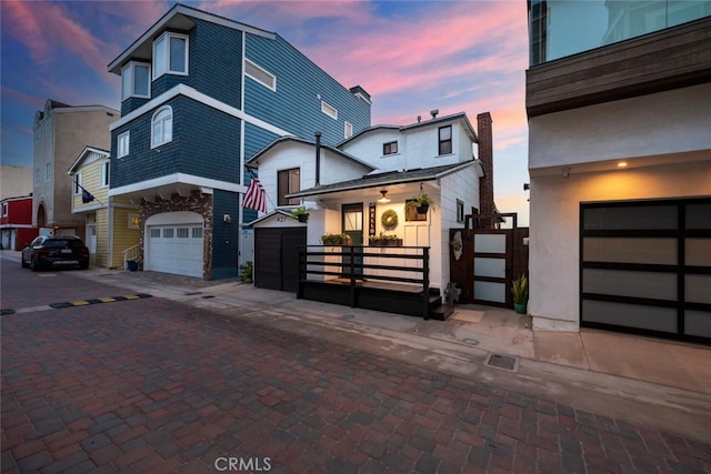 27 A Surfside Ave, Surfside, CA 90743 - view of front of property featuring a gate and a garage