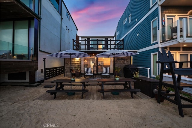 27 A Surfside Ave, Surfside, CA 90743 - back of house at dusk featuring a balcony