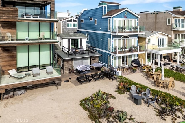 27 A Surfside Ave, Surfside, CA 90743 - rear view of property featuring a balcony