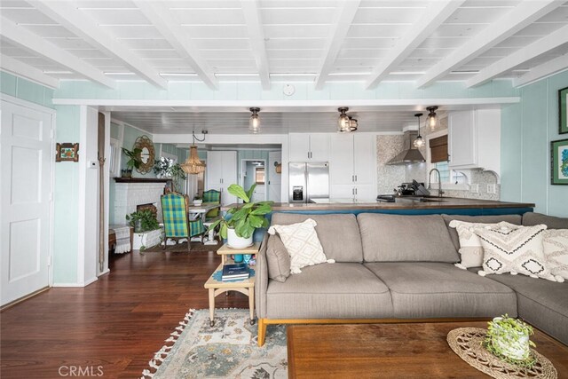 27 A Surfside Ave, Surfside, CA 90743 - living room featuring dark wood-type flooring and beam ceiling