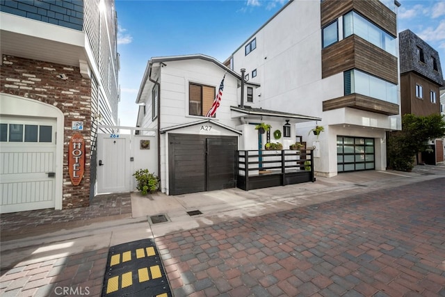 27 A Surfside Ave, Surfside, CA 90743 - view of front of home with a gate