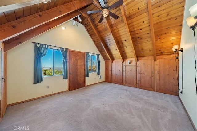 bonus room featuring wood ceiling, carpet floors, beamed ceiling, and ceiling fan