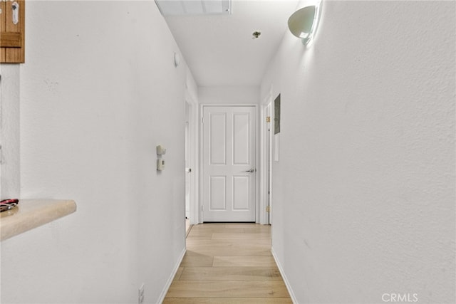19350 Sherman Way Unit 204, Reseda, CA 91335 - hall featuring light wood finished floors and baseboards