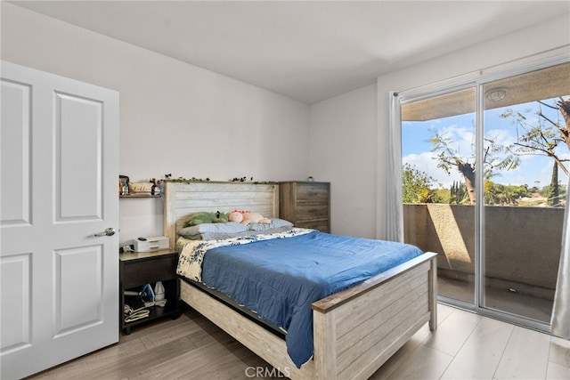 19350 Sherman Way Unit 204, Reseda, CA 91335 - bedroom featuring access to outside and light wood-style floors