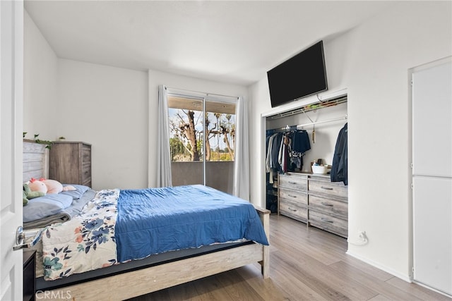 19350 Sherman Way Unit 204, Reseda, CA 91335 - bedroom featuring wood finished floors, a closet, and baseboards