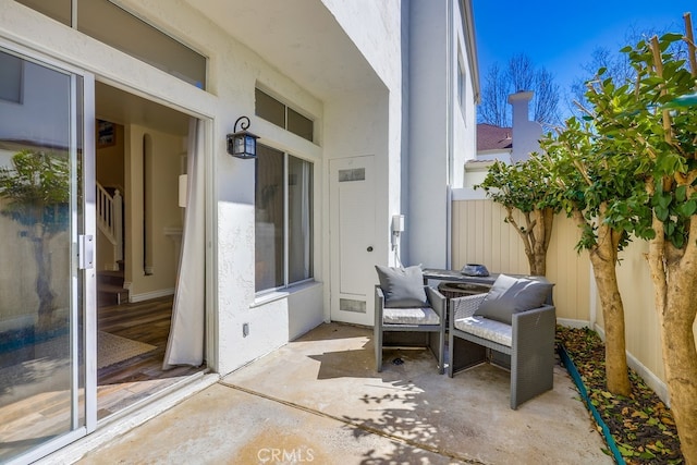 view of patio / terrace featuring fence