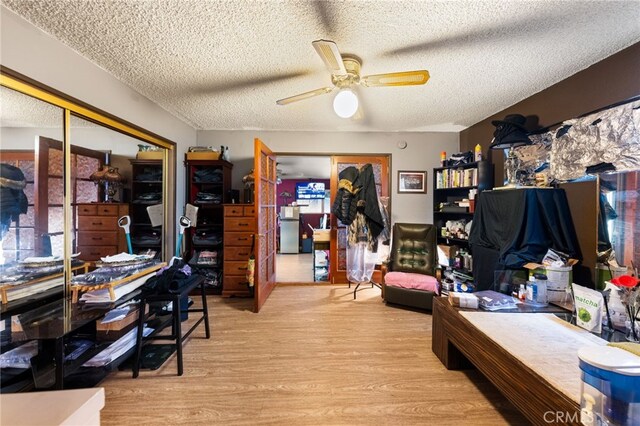 21322 Millpoint Ave, Carson, CA 90745 - home office with wood finished floors, ceiling fan, and a textured ceiling