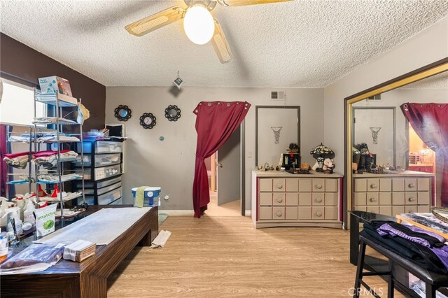 21322 Millpoint Ave, Carson, CA 90745 - bedroom featuring visible vents, a textured ceiling, ceiling fan, and wood finished floors