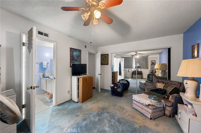 21322 Millpoint Ave, Carson, CA 90745 - living room with a ceiling fan, a textured ceiling, carpet, and visible vents