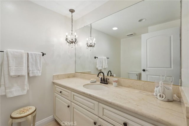 2545 Via Campesina Unit 303, Palos Verdes Estates, CA 90274 - bathroom with toilet, vanity, baseboards, and recessed lighting