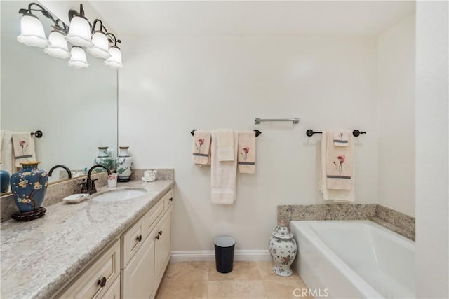 2545 Via Campesina Unit 303, Palos Verdes Estates, CA 90274 - bathroom featuring vanity, a bath, baseboards, and tile patterned flooring