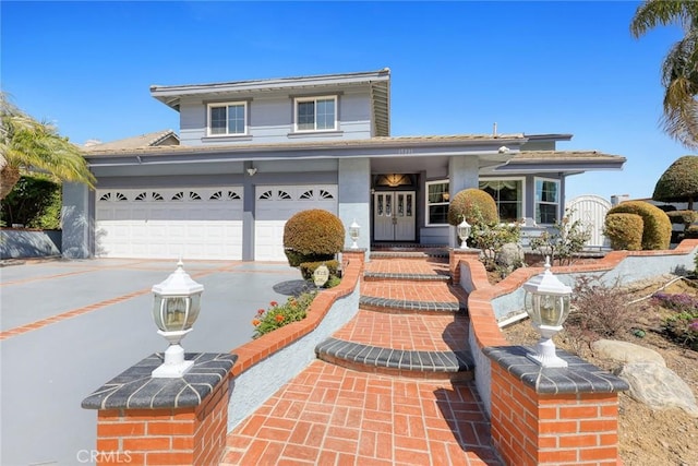 15331 Lillian Pl, Hacienda Heights, CA 91745 - view of front of house with an attached garage, french doors, and concrete driveway