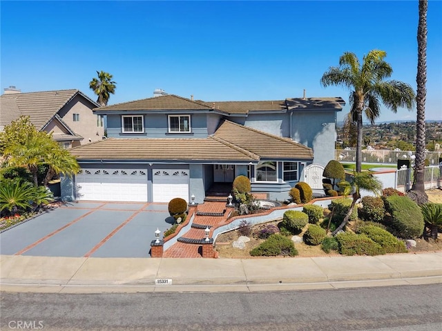 15331 Lillian Pl, Hacienda Heights, CA 91745 - traditional-style home featuring a tile roof, concrete driveway, stucco siding, and fence