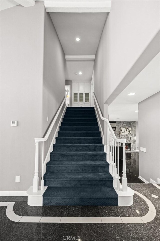 15331 Lillian Pl, Hacienda Heights, CA 91745 - staircase featuring granite finish floor, a fireplace, baseboards, and recessed lighting