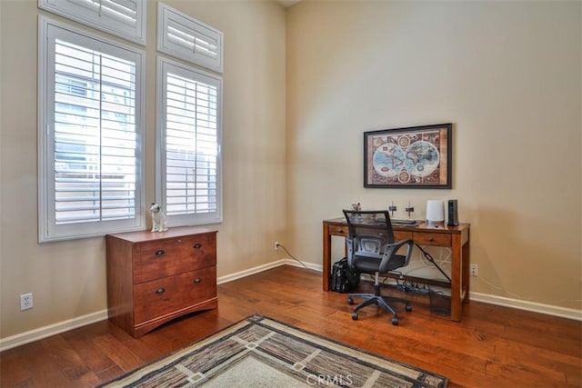 office area featuring dark wood-style floors and baseboards