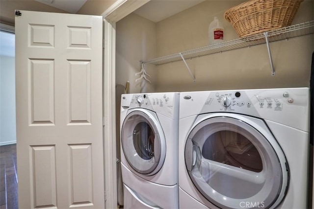 laundry area featuring washer and dryer and laundry area