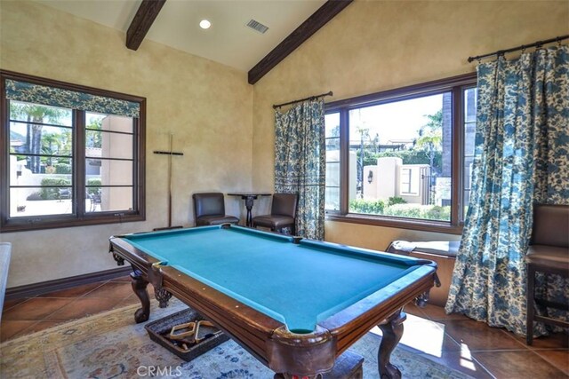 recreation room featuring visible vents, a healthy amount of sunlight, tile patterned flooring, and beamed ceiling