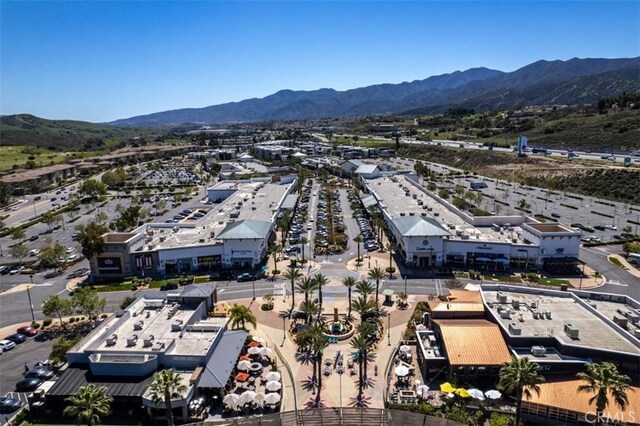 birds eye view of property featuring a mountain view
