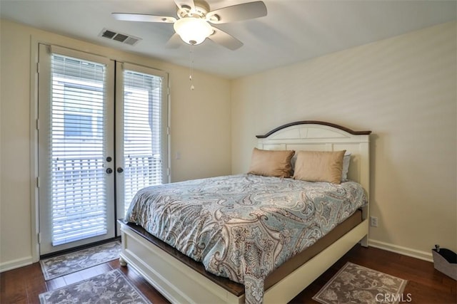 bedroom featuring visible vents, baseboards, wood finished floors, access to exterior, and french doors