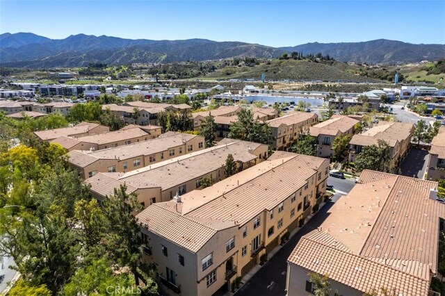 aerial view with a mountain view and a residential view