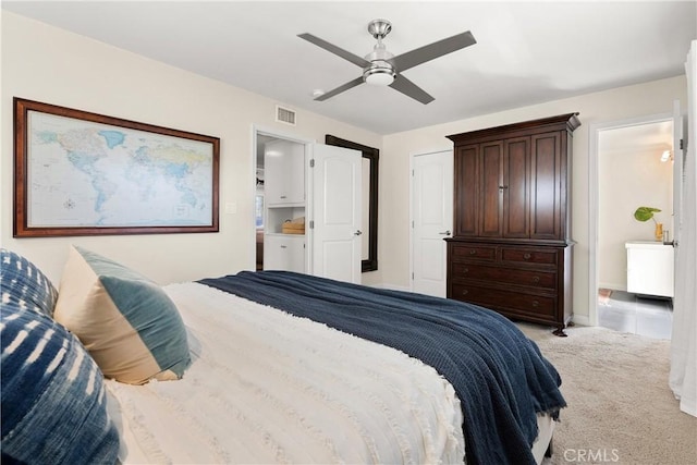bedroom with visible vents, baseboards, a ceiling fan, and light colored carpet