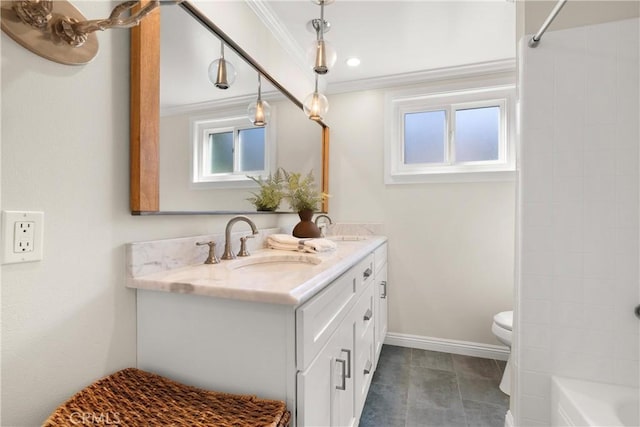 bathroom with toilet, crown molding, double vanity, and a sink