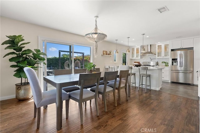 dining room with visible vents, baseboards, recessed lighting, and dark wood finished floors