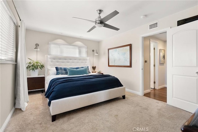 bedroom featuring visible vents, baseboards, ceiling fan, and carpet