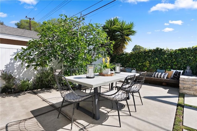 view of patio featuring outdoor dining area