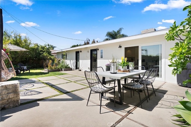 view of patio with outdoor dining area