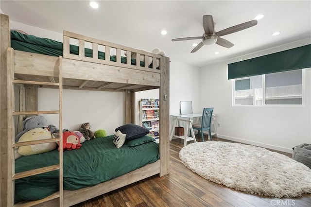bedroom with recessed lighting, wood finished floors, a ceiling fan, and baseboards