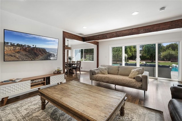 living area featuring hardwood / wood-style flooring, visible vents, and recessed lighting