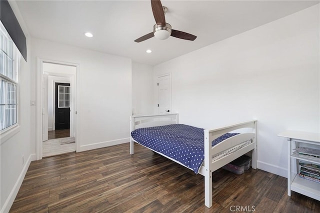 bedroom featuring wood finished floors, baseboards, recessed lighting, and a ceiling fan