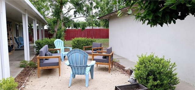 view of patio featuring fence