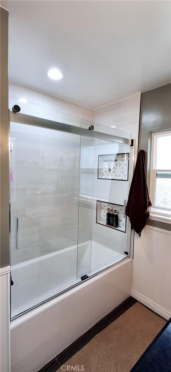 full bath with shower / bath combination with glass door and recessed lighting