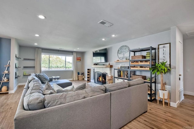2760 Thunder Dr, Oceanside, CA 92056 - living room featuring a tile fireplace, wood finished floors, and recessed lighting