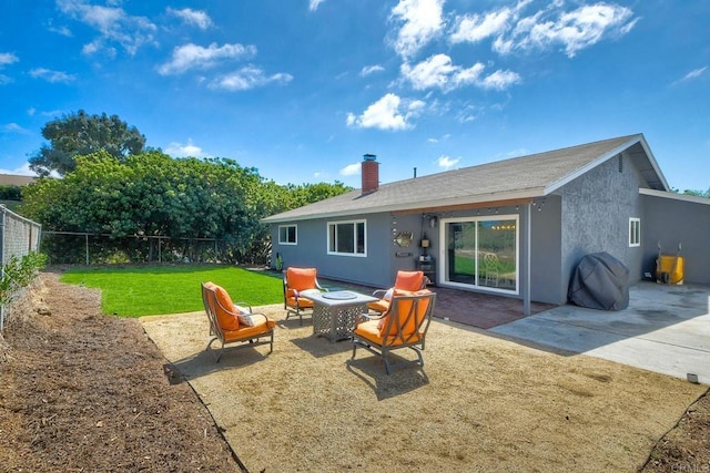 2760 Thunder Dr, Oceanside, CA 92056 - back of property with a fenced backyard, a patio area, stucco siding, and a chimney