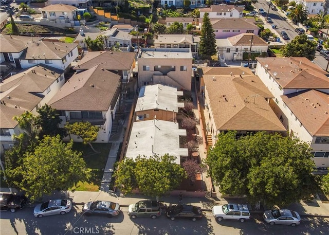 birds eye view of property with a residential view