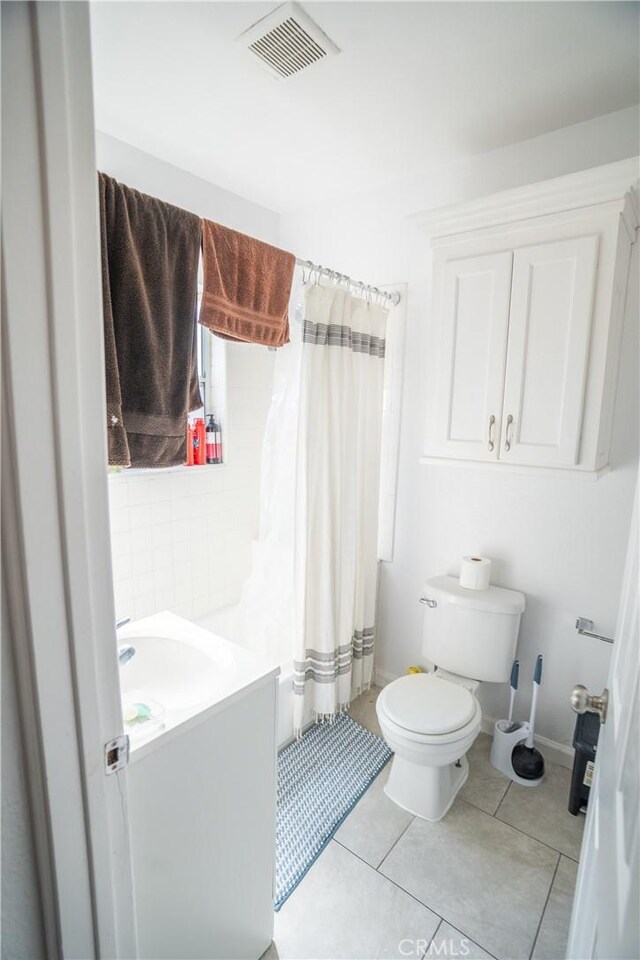 full bath with tile patterned flooring, vanity, toilet, baseboards, and visible vents