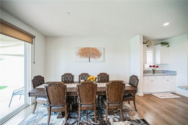dining space featuring recessed lighting and light wood finished floors