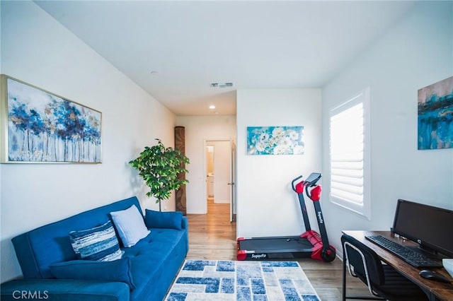 interior space with visible vents and wood finished floors