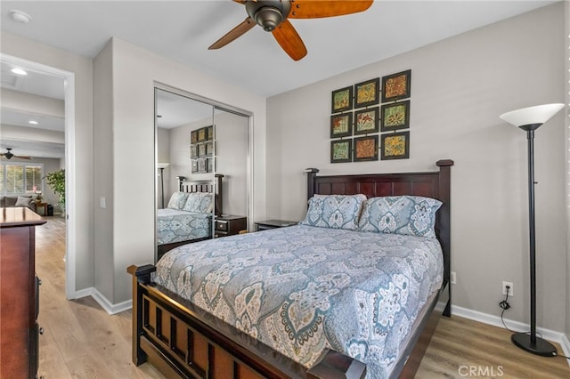 23757 Cahuilla Ct, Corona, CA 92883 - bedroom with light wood-type flooring, a closet, baseboards, and recessed lighting