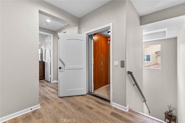 23757 Cahuilla Ct, Corona, CA 92883 - corridor featuring an upstairs landing, wood finished floors, and baseboards